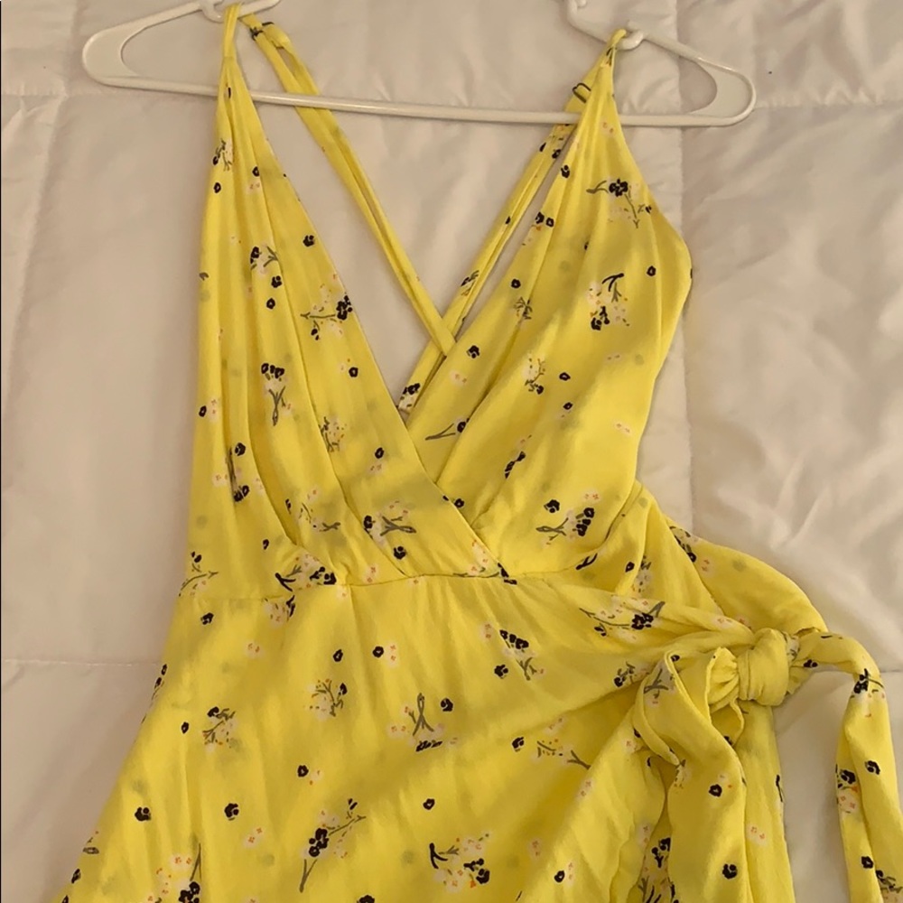 Yellow romper with small flowers